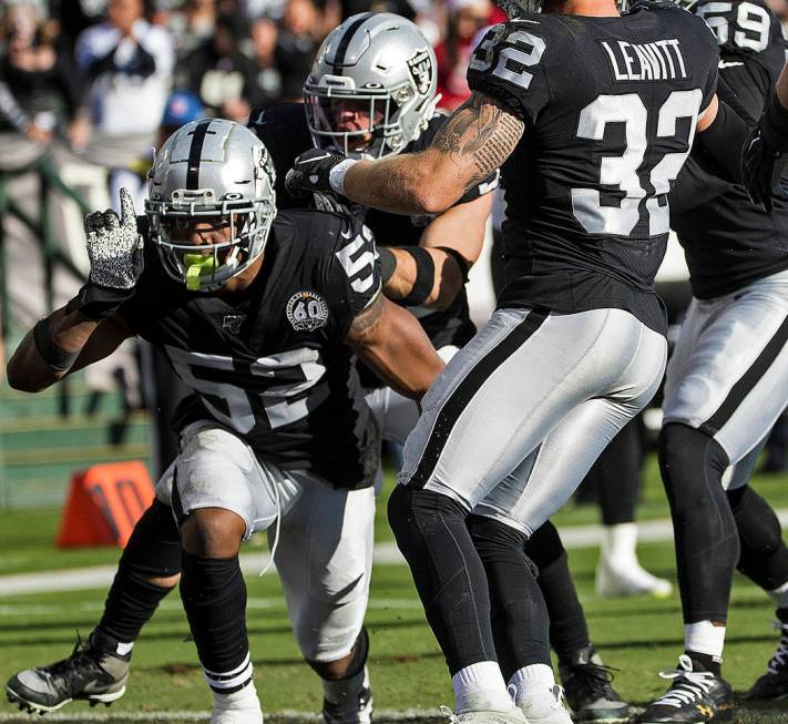 Oakland Raiders middle linebacker Marquel Lee (52) celebrates after making a defensive stop wit ...