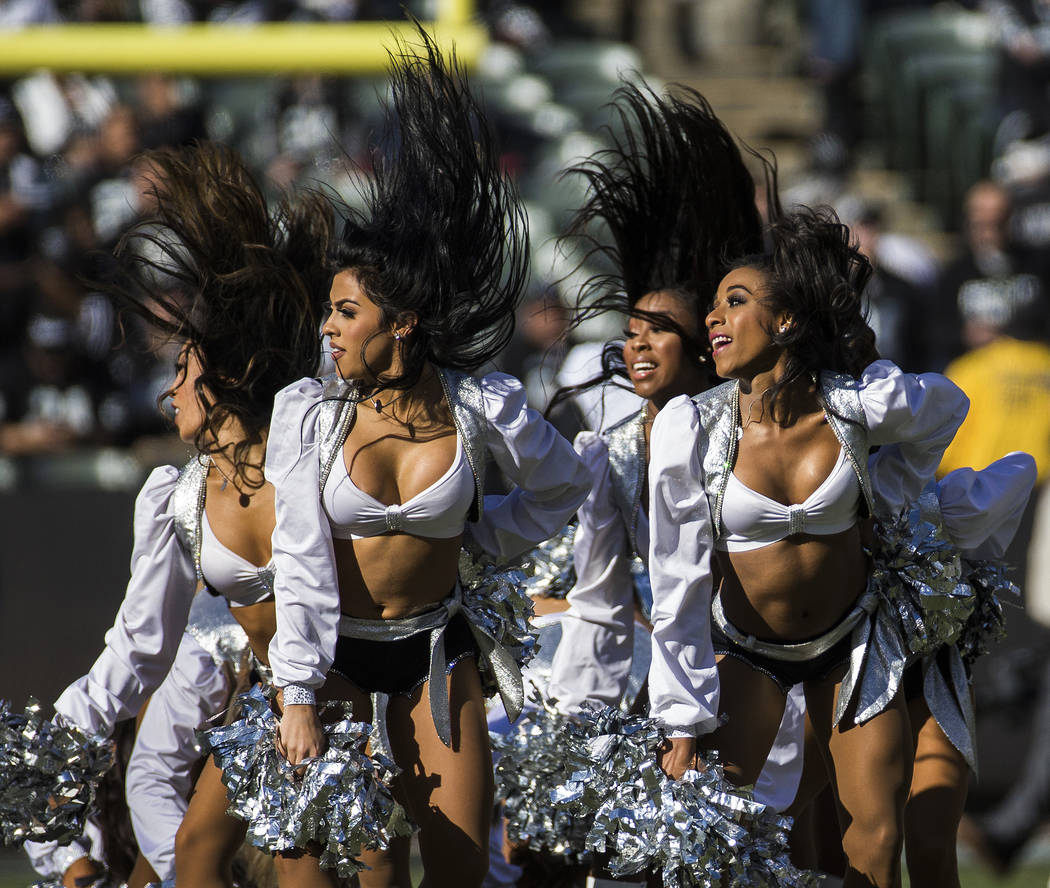 The Raiderettes perform during a break in the first quarter of an NFL football game with the Ja ...