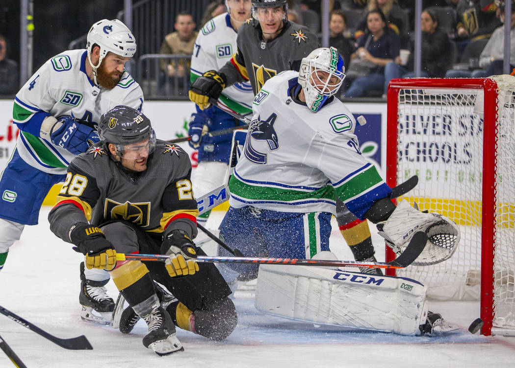 Vegas Golden Knights left wing William Carrier (28) takes a shot at the net on Vancouver Canuck ...