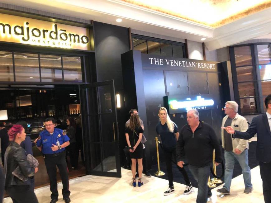 Guests prepare to enter Majordomo Meat & Fish grand opening party on Saturday, Dec. 14, 2019, a ...