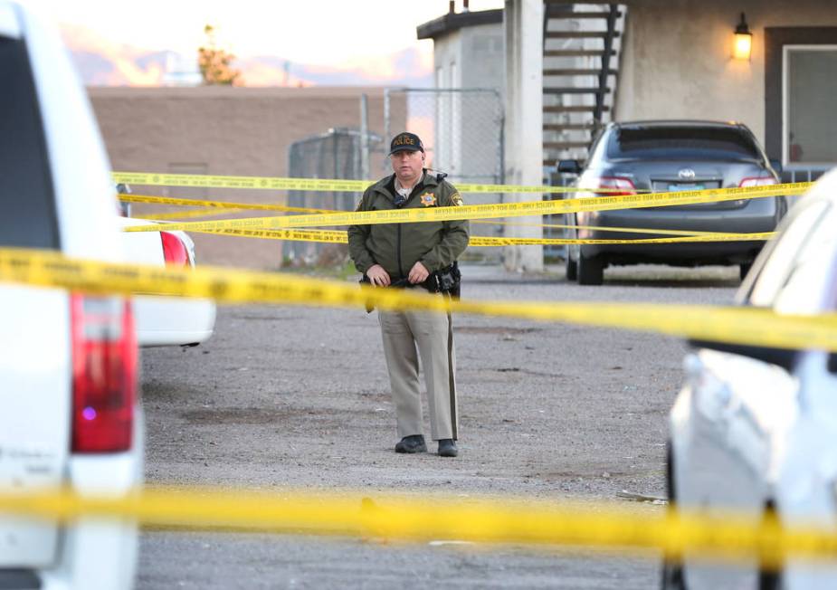 A Metropolitan Police Department officer is seen at the 2300 block of Exeter Drive, near East C ...