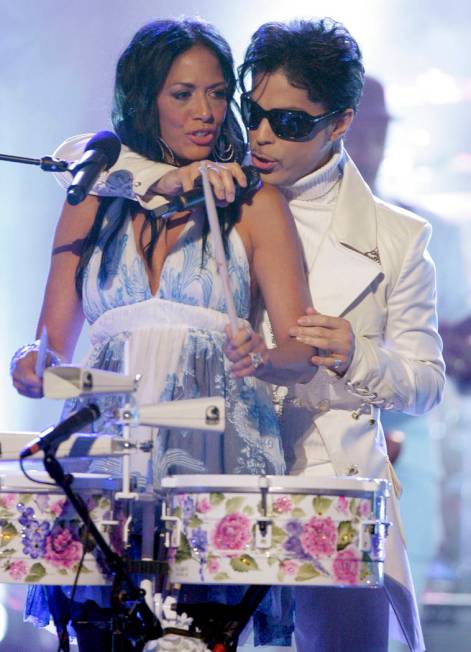 In this June 1, 2007 file photo, Prince performs with Sheila E during the 2007 National Council ...