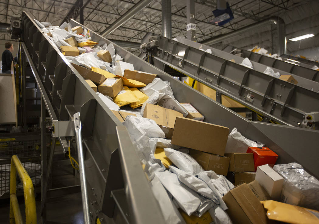 The USPS Mail Processing Annex is full of packages ahead of the holidays on Thursday, Dec. 12, ...