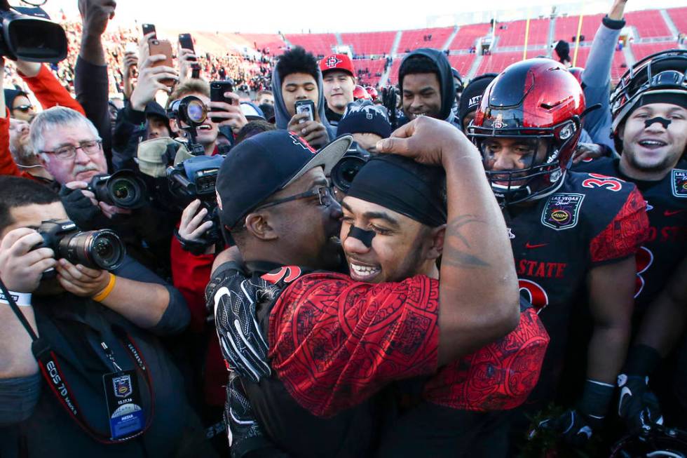 San Diego State running back Donnel Pumphrey (19) celebrates with his father, Donnel Humphrey S ...