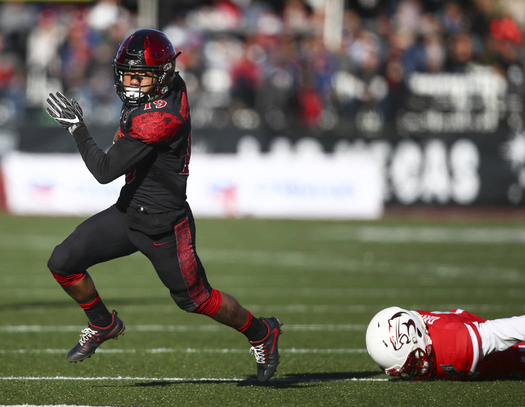 San Diego State running back Donnel Pumphrey (19) runs the ball against Houston during the Las ...