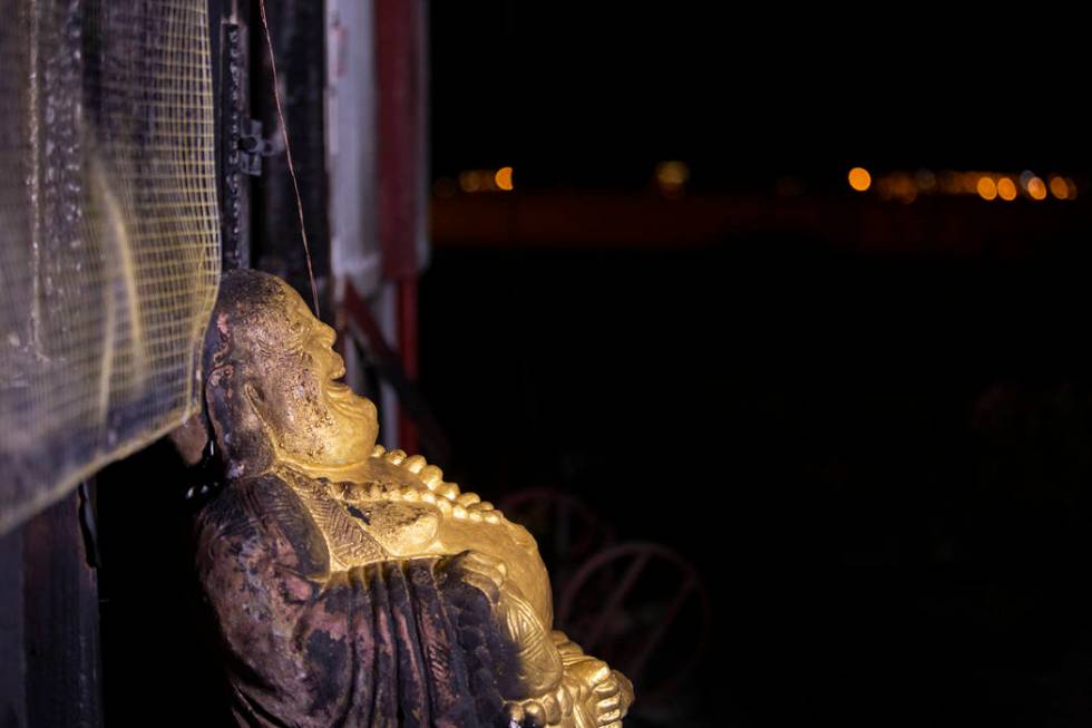 A Buddha statue has burn marks at the Thai Buddhist Temple-Las Vegas, Wat Buddha Pavana,&# ...