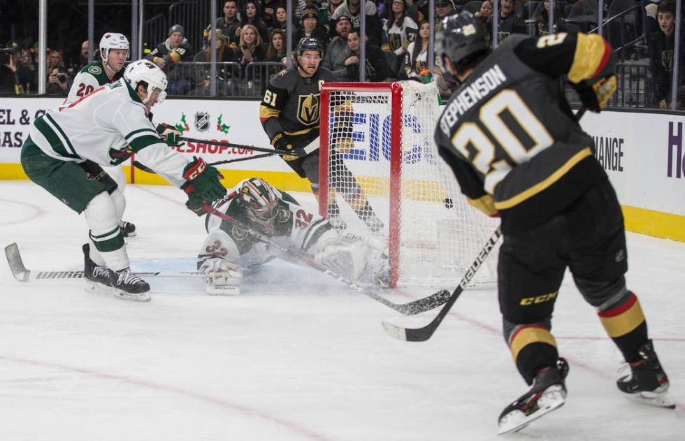 Vegas Golden Knights center Chandler Stephenson (20) scores against Minnesota Wild goaltender A ...