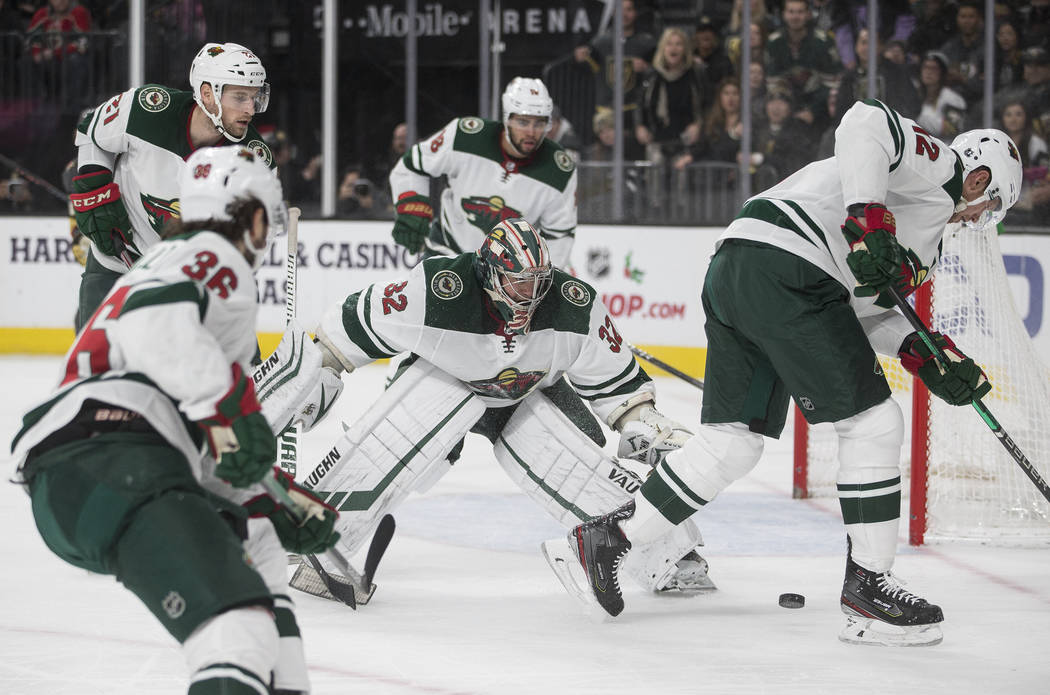 Minnesota Wild goaltender Alex Stalock (32) makes a save in traffic in the second period of an ...