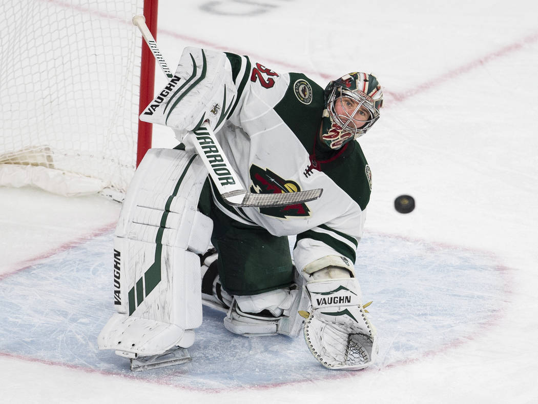 Minnesota Wild goaltender Alex Stalock (32) makes a save in the third period of an NHL hockey g ...