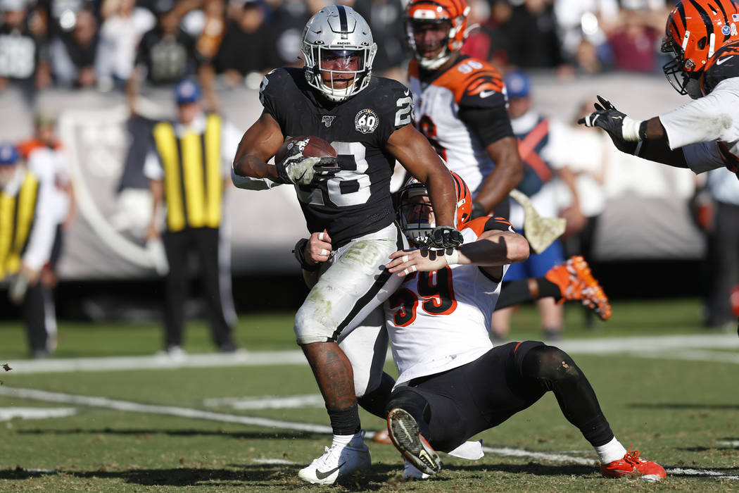 FILE - In this Nov. 17, 2019, file photo, Oakland Raiders running back Josh Jacobs runs with th ...
