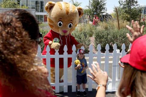 Braeden Klatt, 3, poses for a photo with PBS Kids television star Daniel Tiger during " Be My N ...