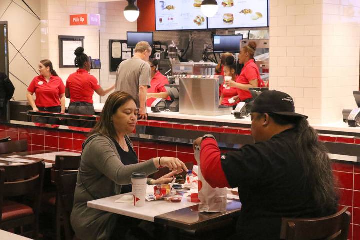 Customers enjoy their meal at the first Chick-fil-A restaurant inside the Golden Nugget on Mond ...