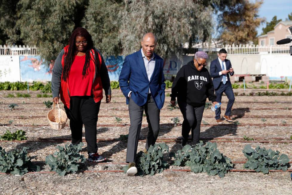 Democratic presidential candidate former Massachusetts Gov. Deval Patrick, center, tours a comm ...