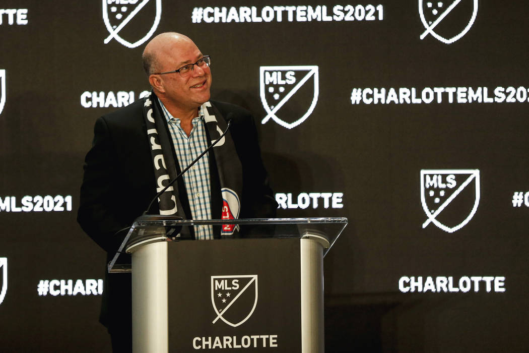 David Tepper looks up at fans as he announces he will bring an MLS soccer team to Charlotte in ...