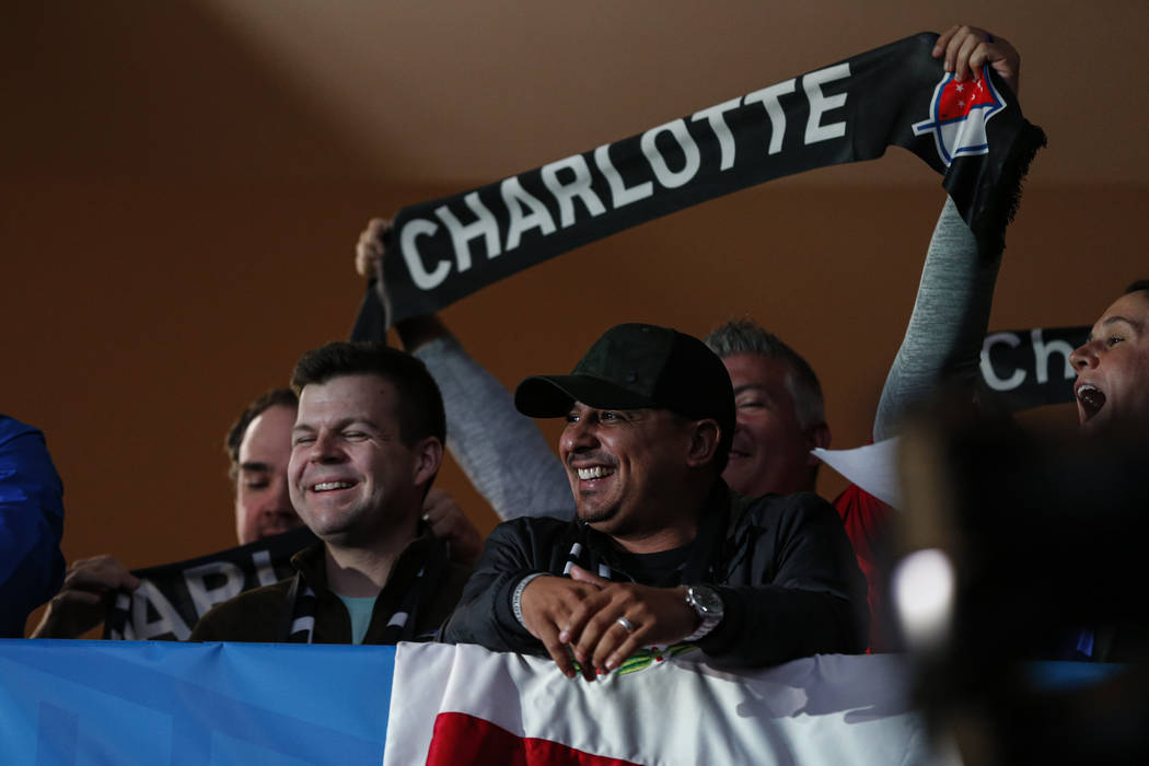 Soccer fans celebrate the announcement of a Major League Soccer team, owned by David Tepper, th ...