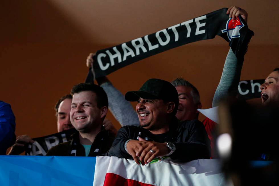 Soccer fans celebrate the announcement of a Major League Soccer team, owned by David Tepper, th ...