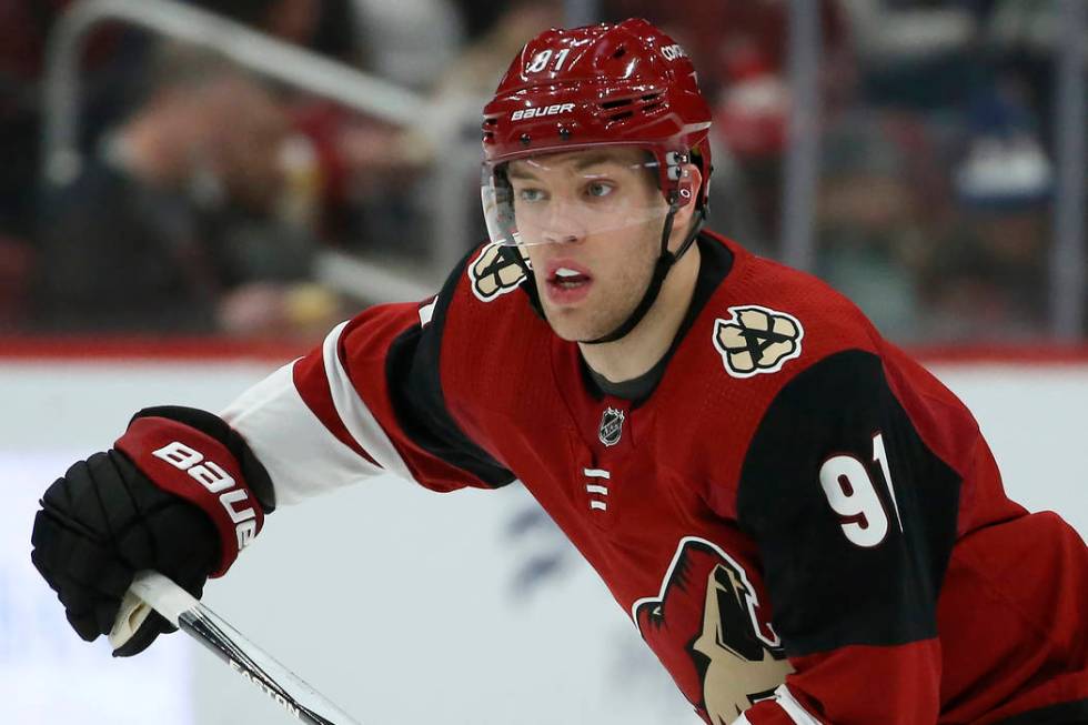 Arizona Coyotes left wing Taylor Hall skates to the puck against the Minnesota Wild during the ...