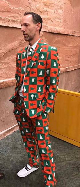 Clark County Commissioner Justin Jones, left, wore a Christmas suit to a Clark County zoning me ...