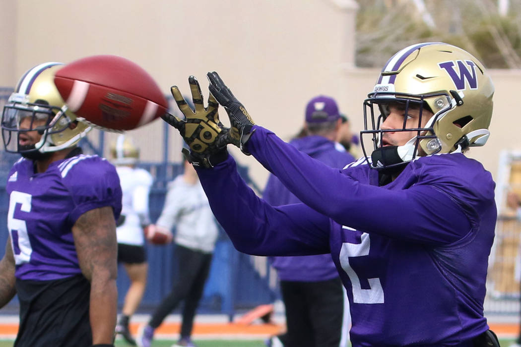 Washington Huskies wide receiver Aaron Fuller catches the ball during his team practice at Bish ...