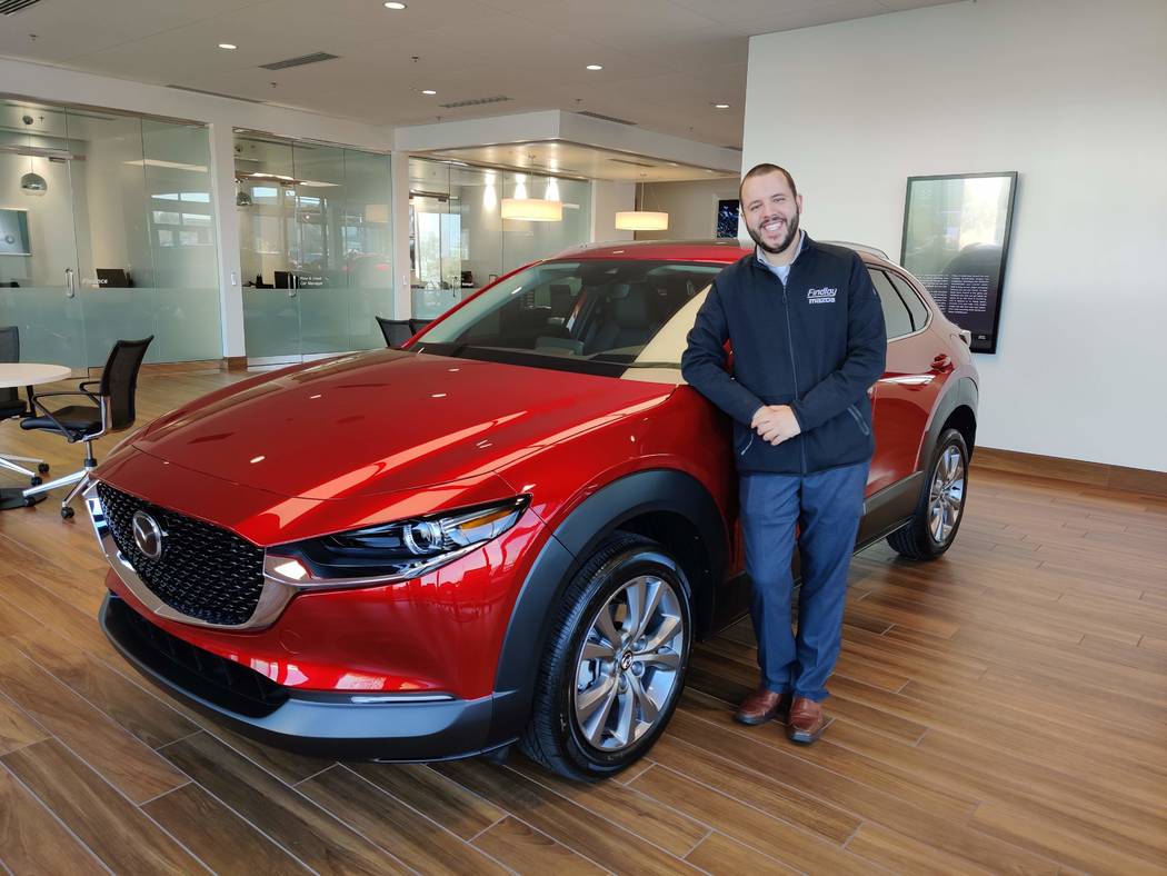 Kevin Lopes, the marketing manager for Findlay Mazda, shows off the 2020 Mazda CX-30 crossover ...