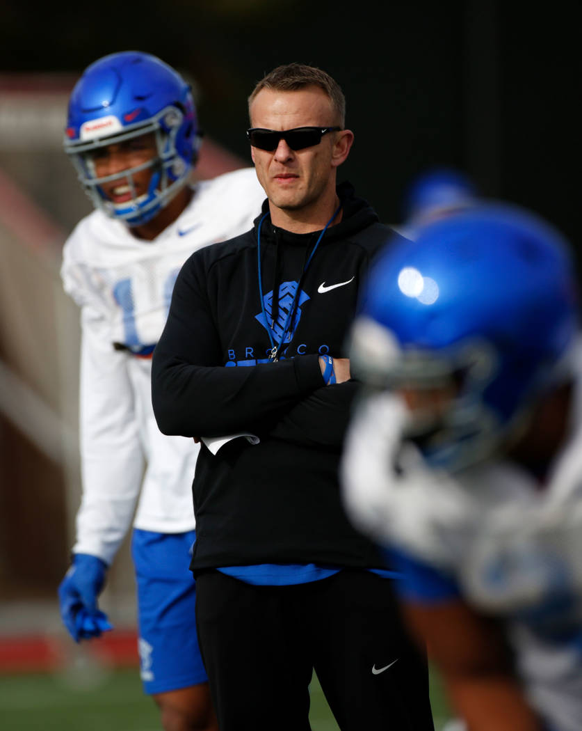 Boise State head coach Bryan Harsin, center, is seen during football practice in Las Vegas, Wed ...