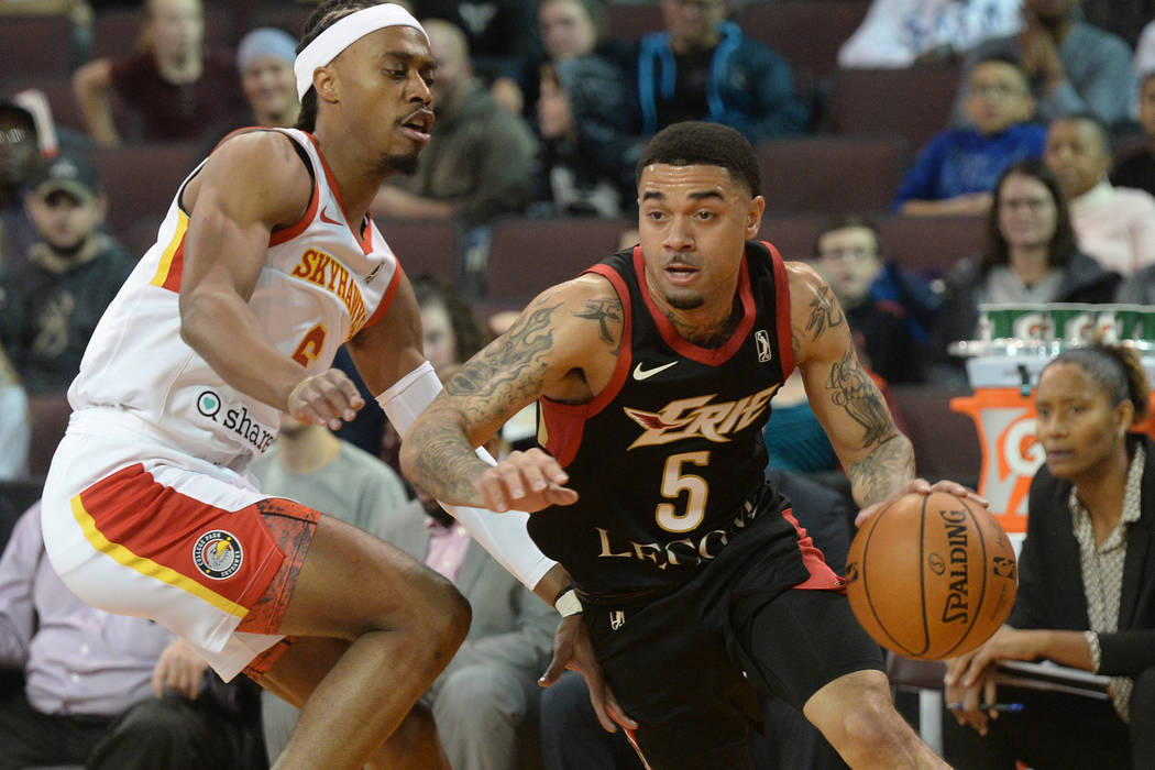 Erie BayHawks' Josh Gray drives around College Park Skyhawks' Tahjere McCall during an NBA G-Le ...