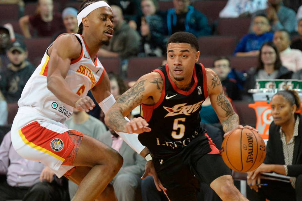 Erie BayHawks' Josh Gray drives around College Park Skyhawks' Tahjere McCall during an NBA G-Le ...