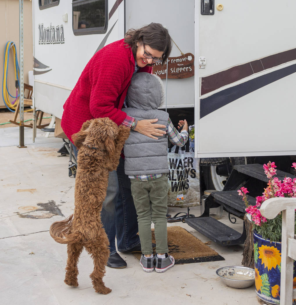 Lisa Bernauer greets her previous student Olamide Ajayi, 6, at Bernauer's home in Las Vegas on ...