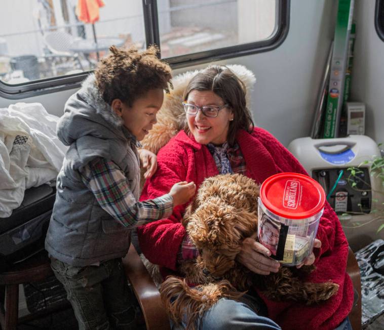 Olamide Ajayi, 6, surprises his mentor Lisa Bernauer with the $1,000 he raised for her cancer t ...