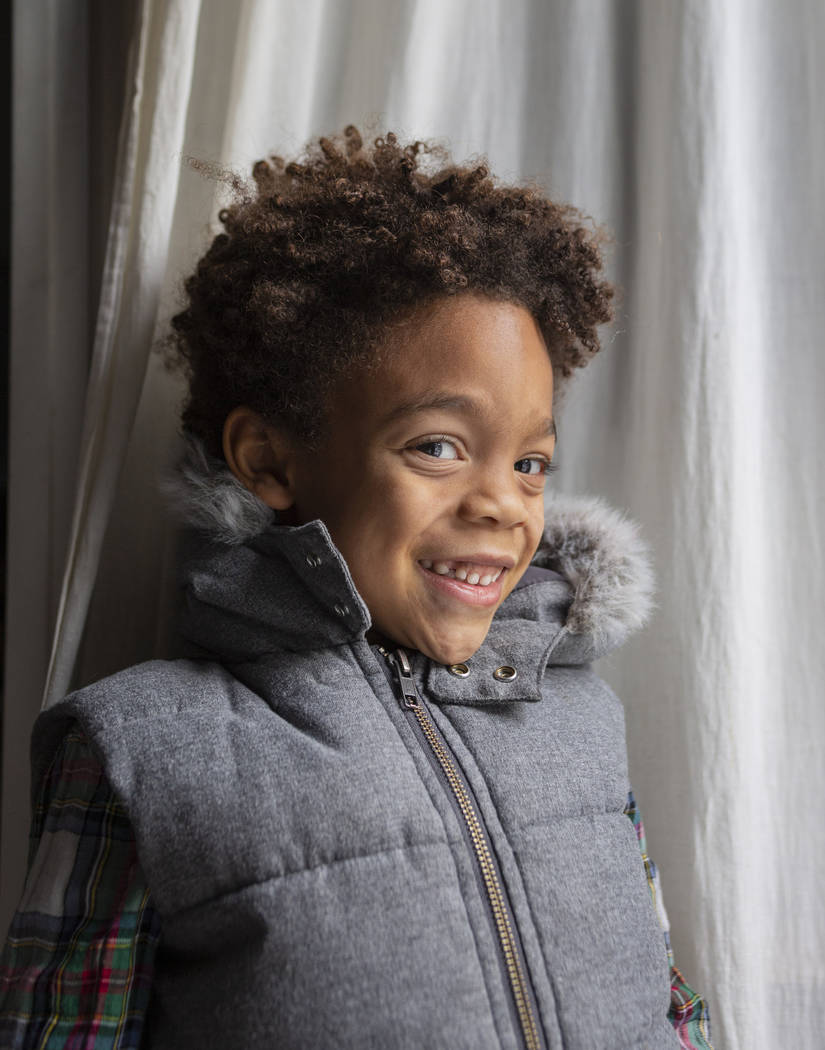 Olamide Ajayi, 6, smiles after surprising his mentor Lisa Bernauer with the $1,000 he raised fo ...