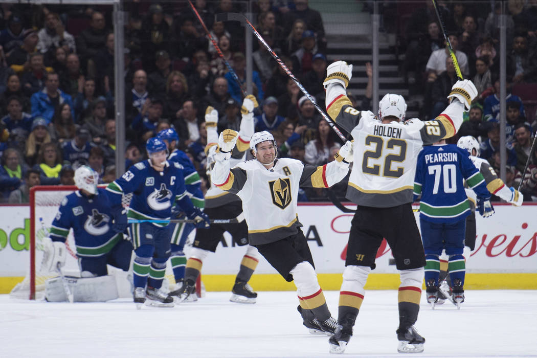 Vegas Golden Knights defenseman Nick Holden (22) celebrates his goal against the Vancouver Canu ...