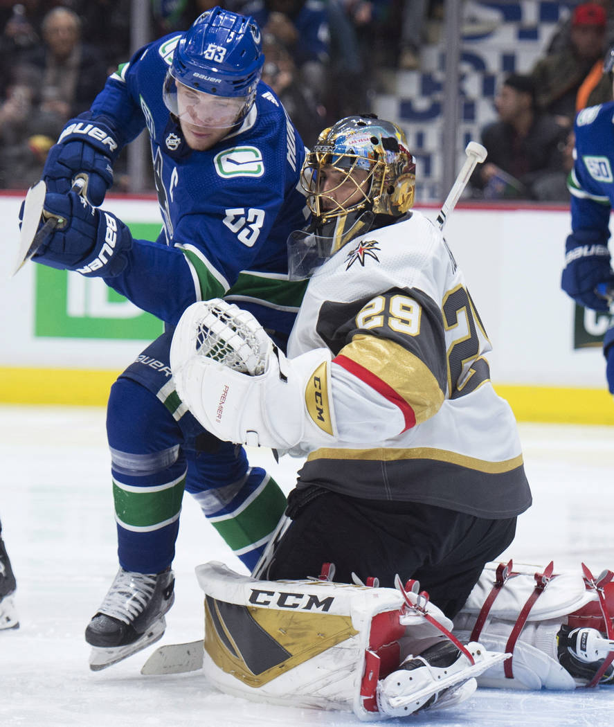 Vancouver Canucks center Bo Horvat (53) fails to get the puck past Vegas Golden Knights goalten ...