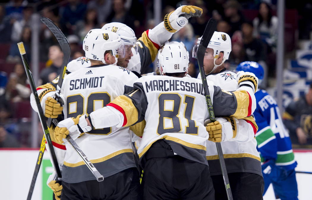 Vegas Golden Knights center Jonathan Marchessault (81) celebrates his goal with teammates durin ...