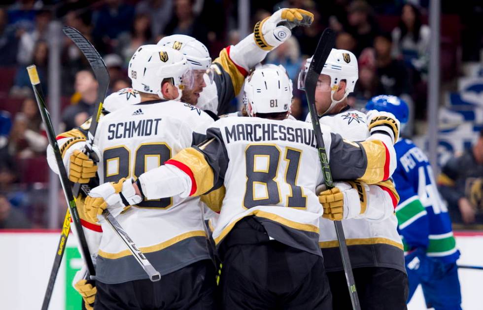 Vegas Golden Knights center Jonathan Marchessault (81) celebrates his goal with teammates durin ...