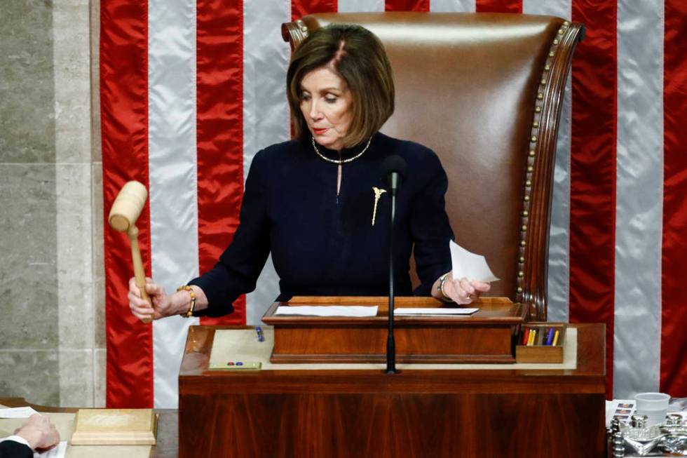 House Speaker Nancy Pelosi of Calif., strikes the gavel after announcing the passage of article ...