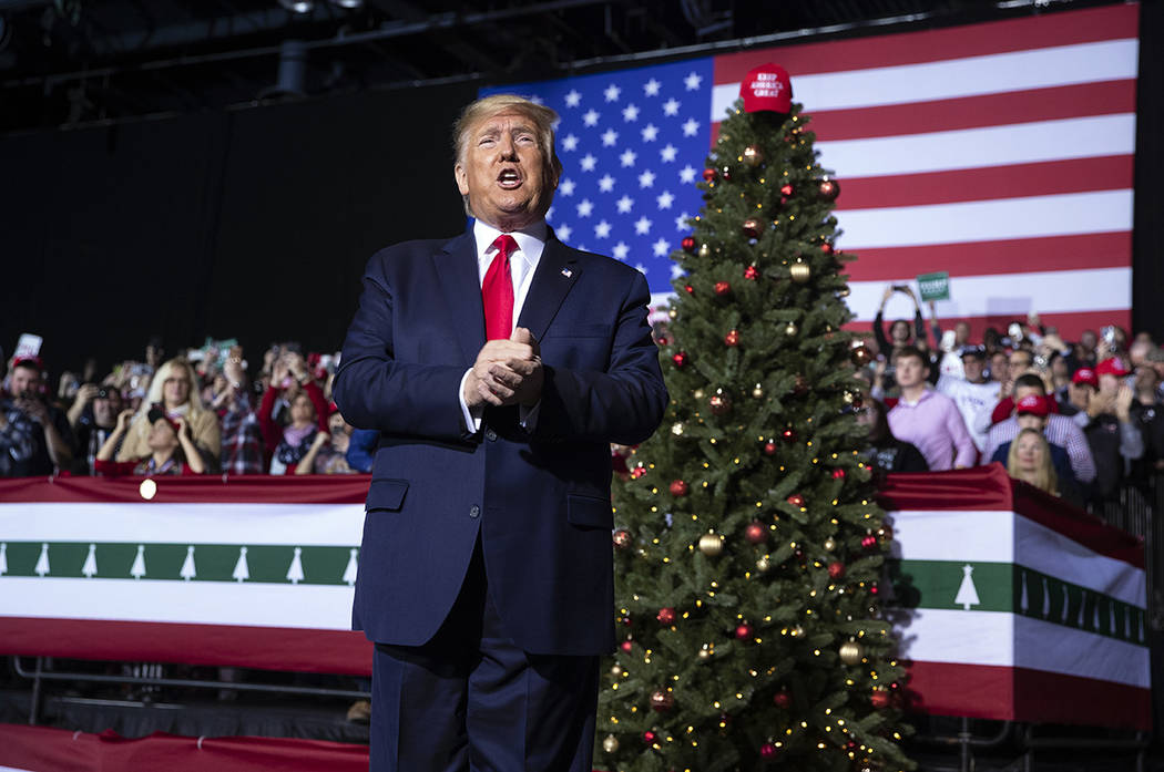 President Donald Trump arrives at W.K. Kellogg Airport to attend a campaign rally, Wednesday, D ...