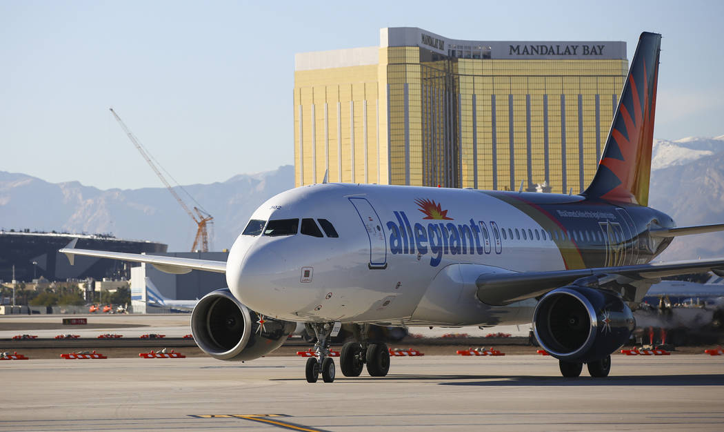 An Allegiant flight from San Antonio heads to the gate after being welcomed with a water cannon ...