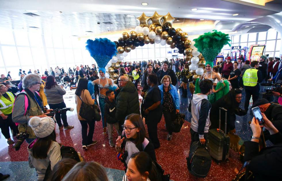 Passengers deplaning from an Allegiant flight from San Antonio are welcomed with fanfare during ...