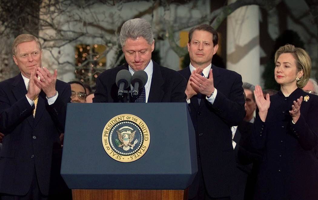 President Clinton receives applause from Rep. Richard Gephardt, D-Mo., Vice President Gore and ...