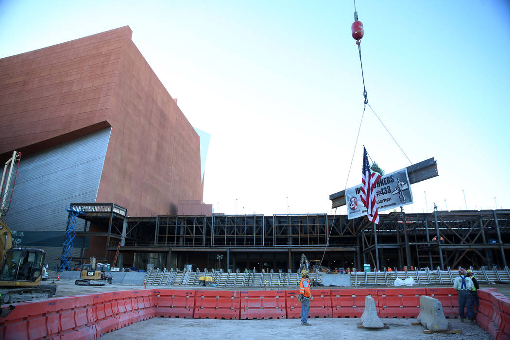 A beam is lifted during a topping-off ceremony for the Expo at World Market Center in Las Vegas ...