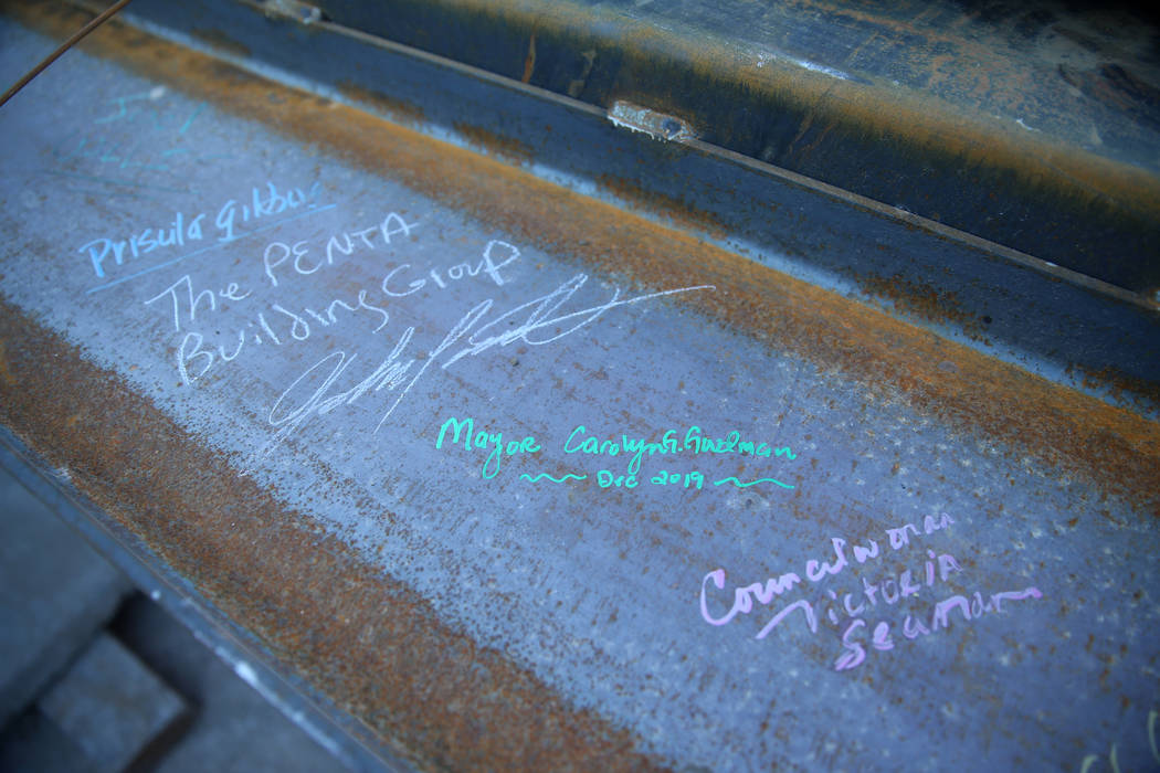 A beam with signatures of guests during a topping-off ceremony for the Expo at World Market Cen ...