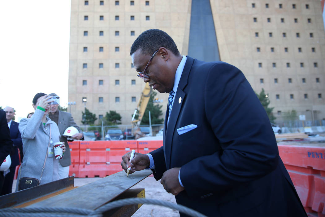 Las Vegas Councilman Cedric Crear signs a beam during a topping-off ceremony for the Expo at Wo ...
