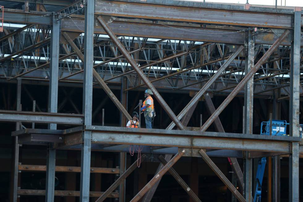 Workers at the construction site for the Expo at World Market Center in Las Vegas, Thursday, De ...