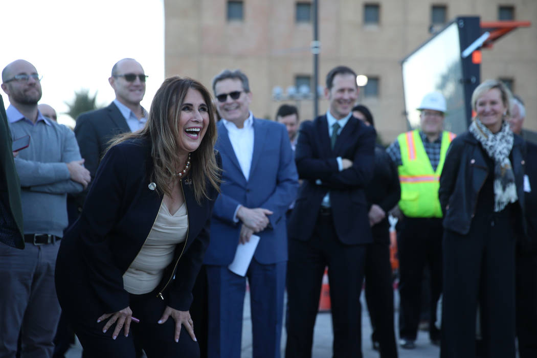 Las Vegas Councilwoman Victoria Seaman shares a laugh during a topping-off ceremony for the Exp ...