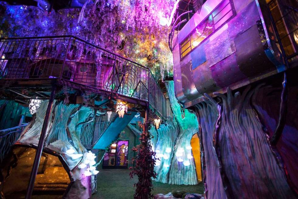 A treehouse is suspended in a purple canopy at Meow Wolf House of Eternal Return. (Kate Russell ...