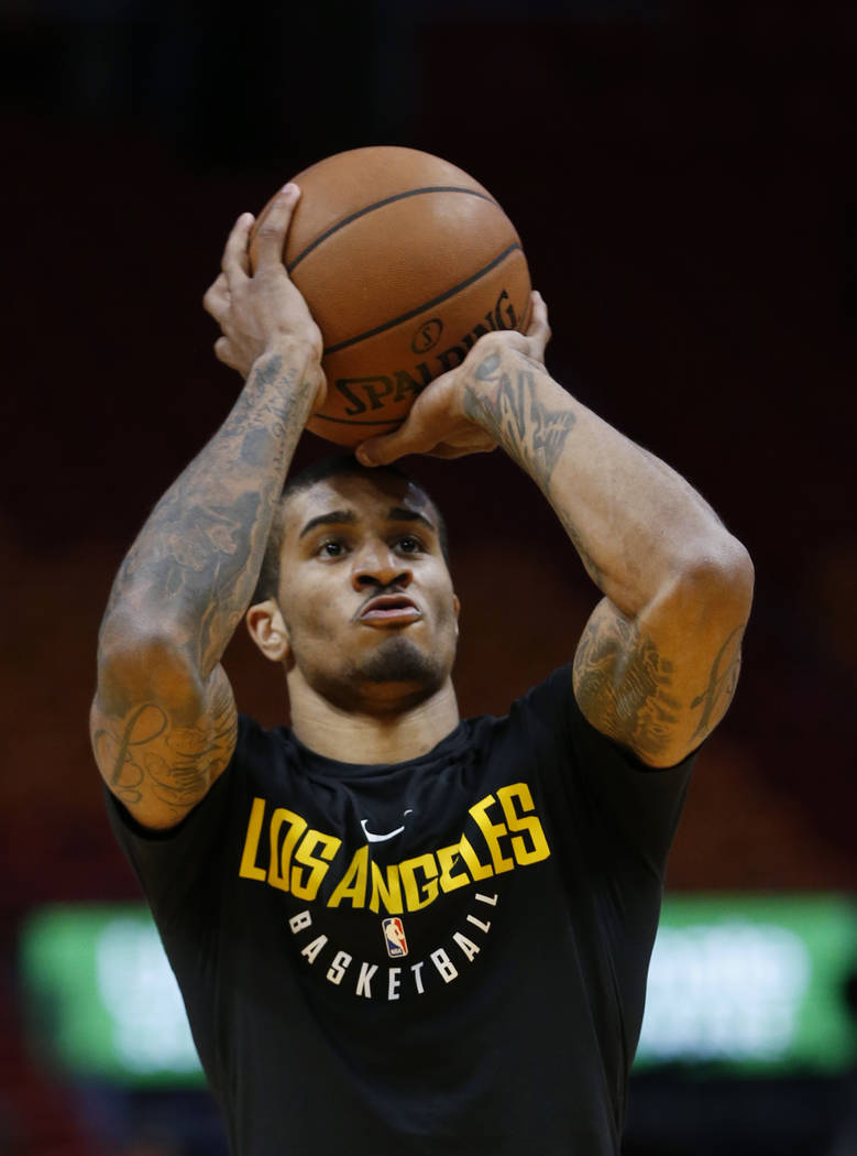 Los Angeles Lakers guard Gary Payton II warms up before the start of an NBA basketball game aga ...