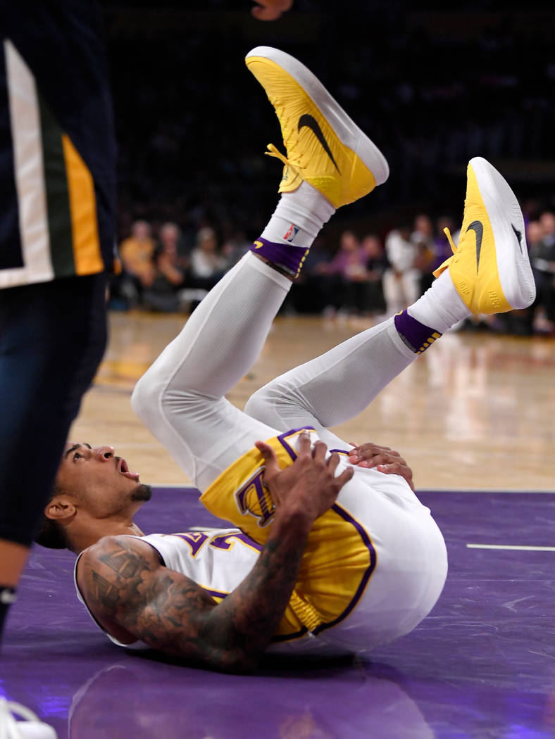 Los Angeles Lakers guard Gary Payton II yells as he scores and draws a foul during the first ha ...