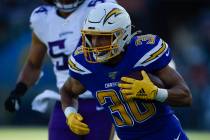 Los Angeles Chargers running back Austin Ekeler runs with the ball during the first half of an ...