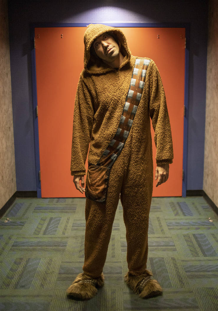 Justin Dove of Fort Collins, Colorado poses for a portrait dressed in a Chewbacca onesie at the ...