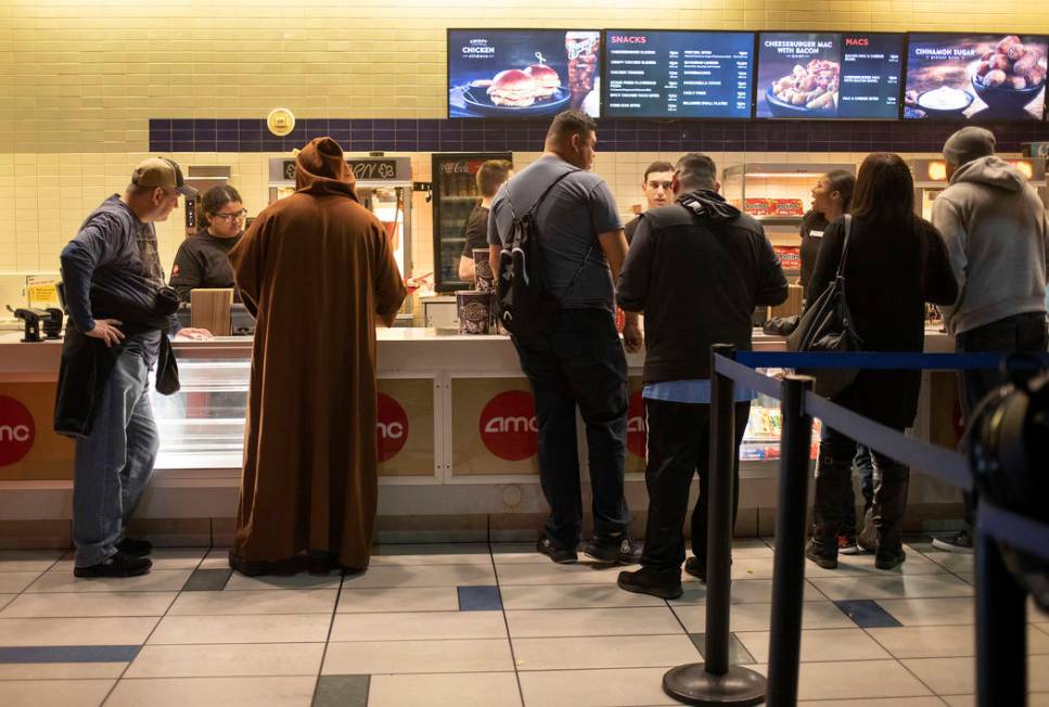 The line for snacks is busy before the Star Wars: The Rise of Skywalker premiere at AMC Town Sq ...